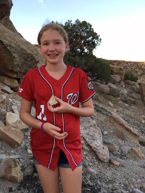 Young girl at Mesa Verde National Park with pottery shard