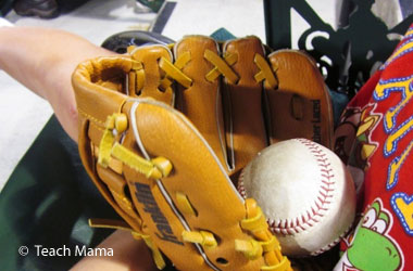 photo of a baseball mit with a baseball inside it