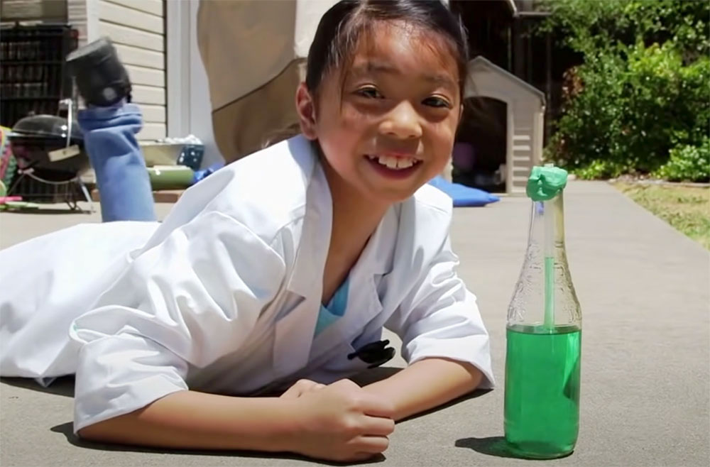 photo of a child with a homemade bottle thermometer