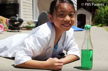 photo of a child with a homemade bottle thermometer
