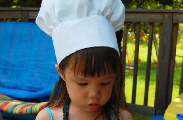 child wearing a homemade chef's hat