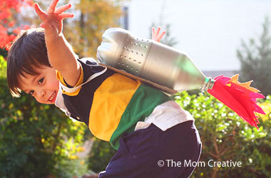 young boy wearing a homemade jet pack