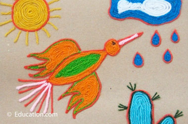 art showing bird, rain, cloud, and sun made of yarn