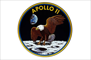 Apollo 11 mission patch with eagle above the moon.