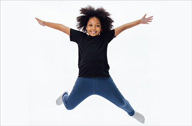Young boy jumping in the air