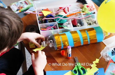 child making paper rocket