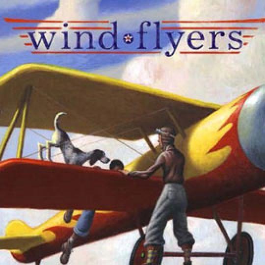 cover of "wind flyers" showing boy and dog on the wing of a prop plane