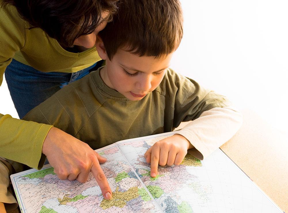 Child and parent looking at a map