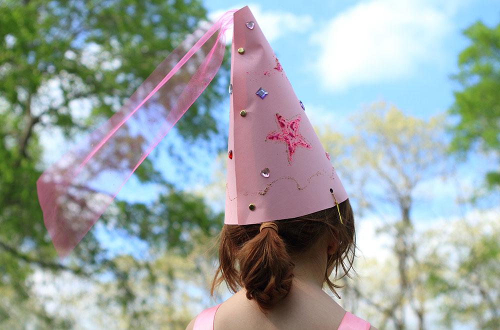 young child in a princess cone cap