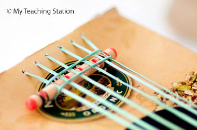 close up of guitar made from cereal box