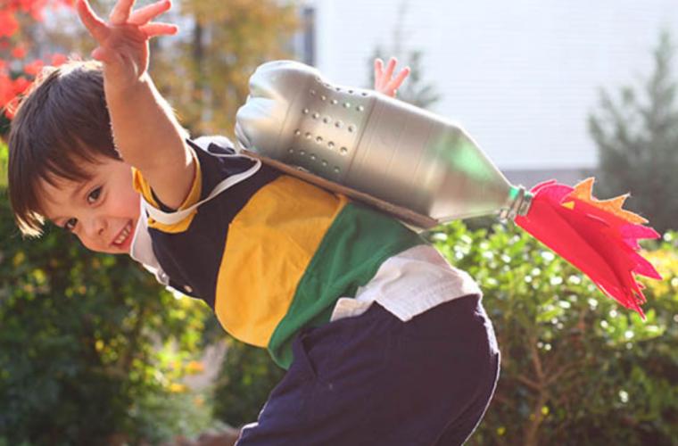 young boy wearing a homemade jetpack