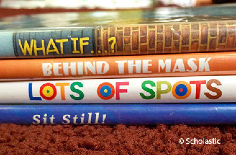 photographic cover of Spine Poetry showing the spines of a stack of books