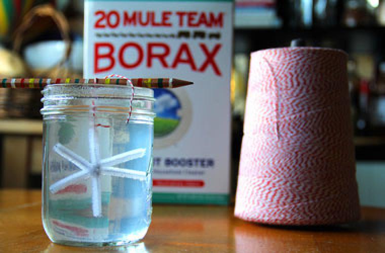 photo of string and a box of borax. looks like snowflake shape is in glass jar.