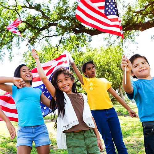 Children waving American flags.